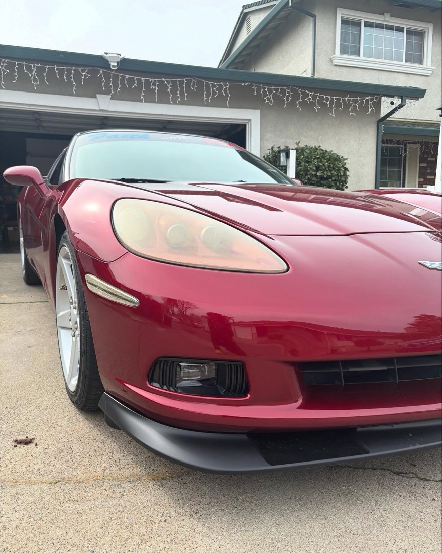 Red Corvette C6 finished and gleaming in a driveway